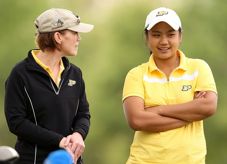 Purdue's Junthima Gulyanamitta talks with assistant women's golf coach JoJo Robertson during the final round of the UCF Challenge at Red Tail Golf Club.
