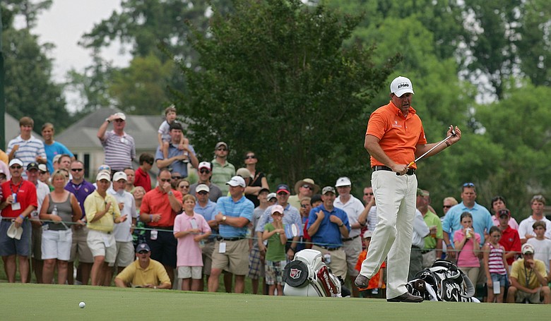 Hundreds of fans followed Mickelson from hole to hole at the TPC Southwind course, many wearing pink in support of Mickelson and the fight against breast cancer.