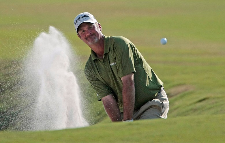 Jerry Kelly hits from a fairway bunker on the 18th hole during the third round of the Zurich Classic.