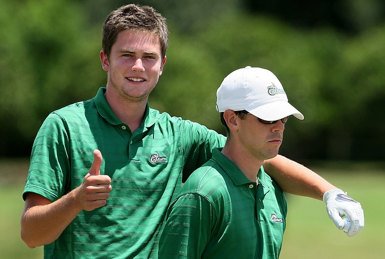 Charlotte's Corey Nagy jokes around with head coach Adam Pry.