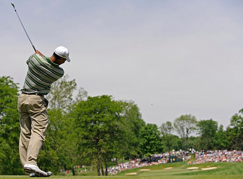 Tiger Woods tees off on the fourth hole during the third round of the Memorial Tournament at Muirfield Village Golf Club.