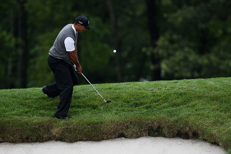 Tiger Woods hits a shot on the 15th hole during the continuation of the first round of the 109th U.S. Open.