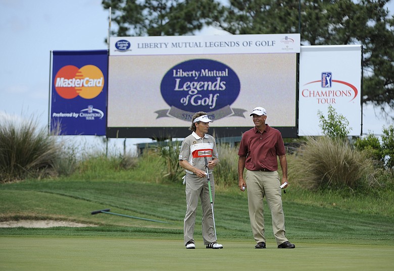 Tom Lehman and Bernhard Langer wait to putt on the 17th green during the final round of the Legends Division at the Liberty Mutual Legends of Golf.