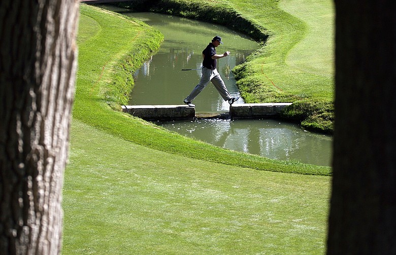Ernie Els of South Africa crosses the creek on the 14th hole during the second round of the Memorial Tournament.