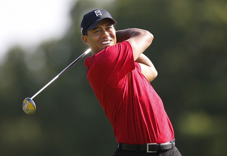 Tiger Woods tees off at the Buick Open.