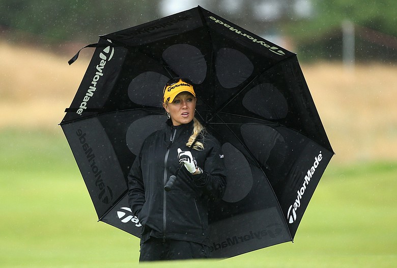 Natalie Gulbis of USA shelters under an umbrella during the Pro-Am prior to the 2009 Ricoh Women's British Open Championship held at Royal Lytham St Annes Golf Club.