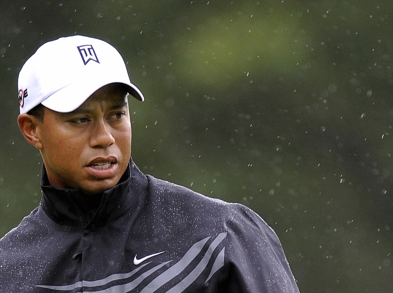 Tiger Woods in the rain during the first round of the U.S. Open at Bethpage.
