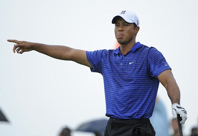 Tiger Woods hits an errant drive during the third round of The Barclays.