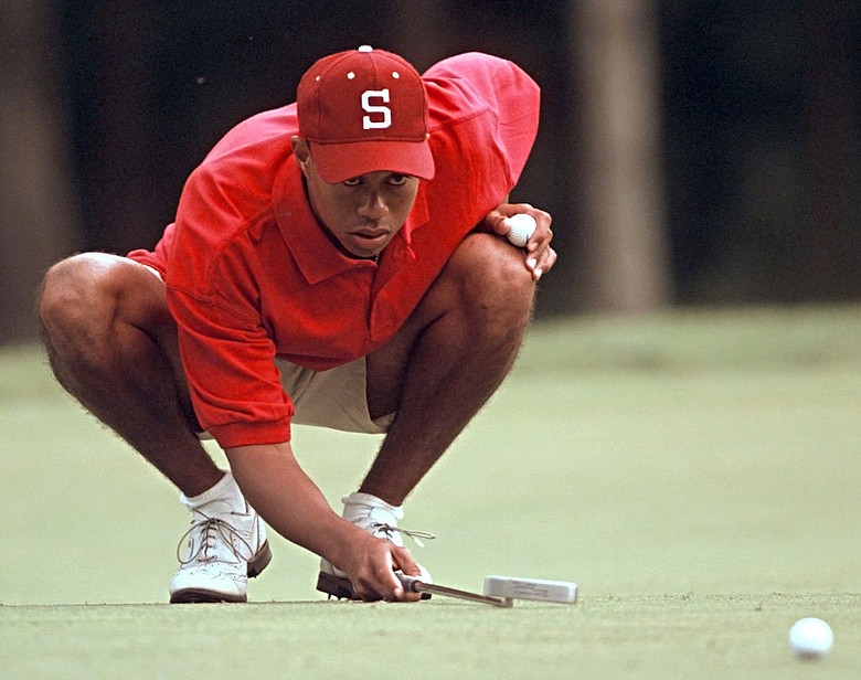 Tiger Woods lines up a putt during the final round of the NCAA Championship in 1996. Woods, a sophomore, won the individual title.