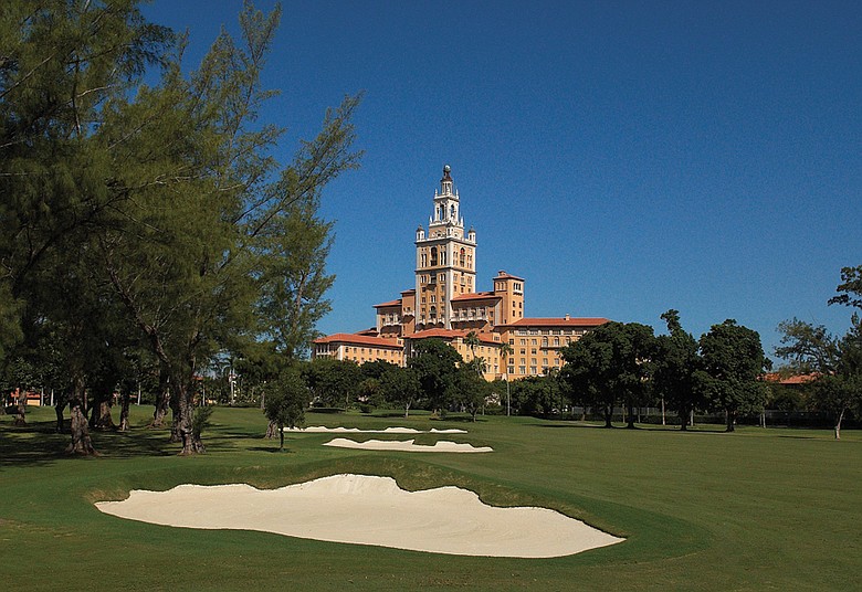 The Biltmore hotel rises majestically over Donald Ross’ renovated 1925 course as refurbished bunkers line the 18th.