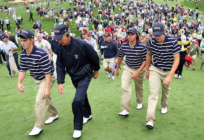 Bud Cauley, U.S. captain Buddy Marucci, Rickie Fowler and Peter Uihlein march off the course after taking a 3-1 lead in morning foursome matches.