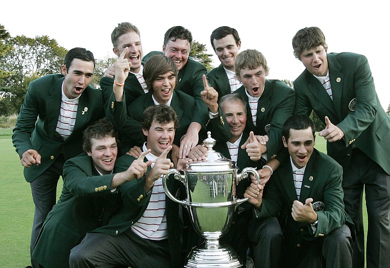 Members of Team USA celebrate with the Walker Cup.