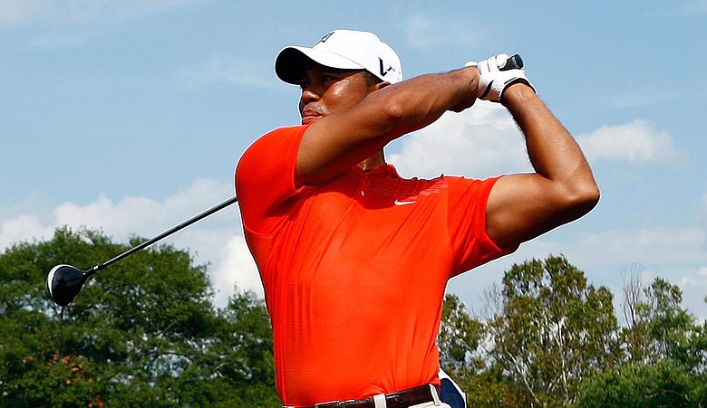 Tiger Woods hits his tee shot on the seventh hole during the second round of the Tour Championship.