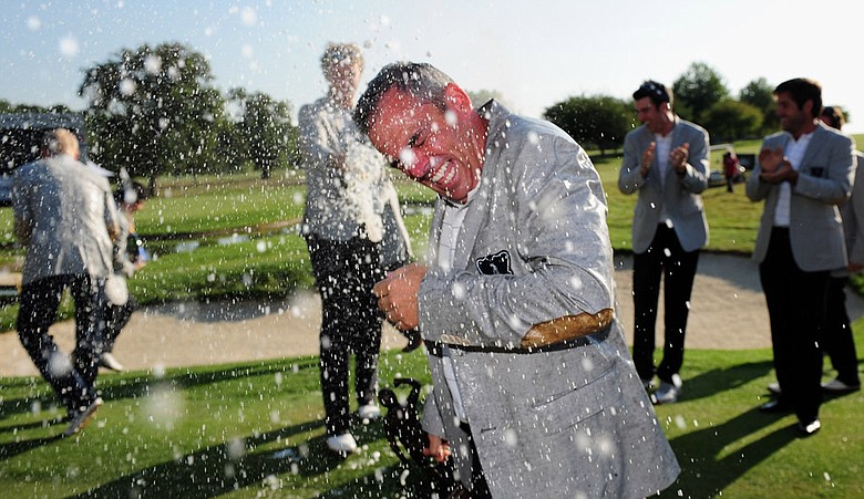 GB&I captain Paul McGinley gets sprayed with champagne by team members after winning the final day singles matches at the Vivendi Trophy.