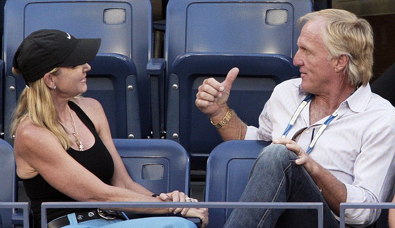 Chris Evert and Greg Norman watch a semifinal match at the U.S. Open tennis tournament in September.