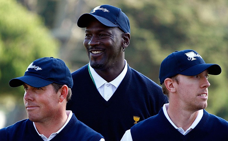 U.S. Presidents Cup assistant captain Michael Jordan waits on the practice ground alongside Justin Leonard (left) and Hunter Mahan during Tuesday’s practice round.