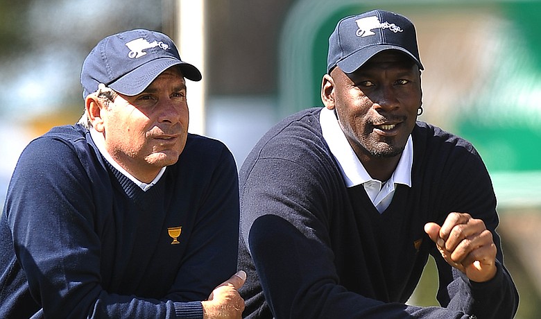 U.S. Team captain Fred Couples watches a practice round with Michael Jordan at the Presidents Cup.