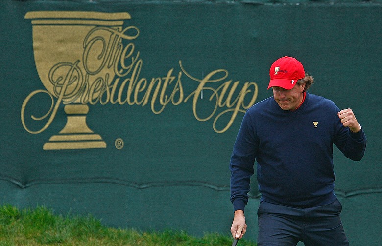 Phil Mickelson celebrates a birdie putt on the 15th green during the Sunday singles matches at Harding Park.