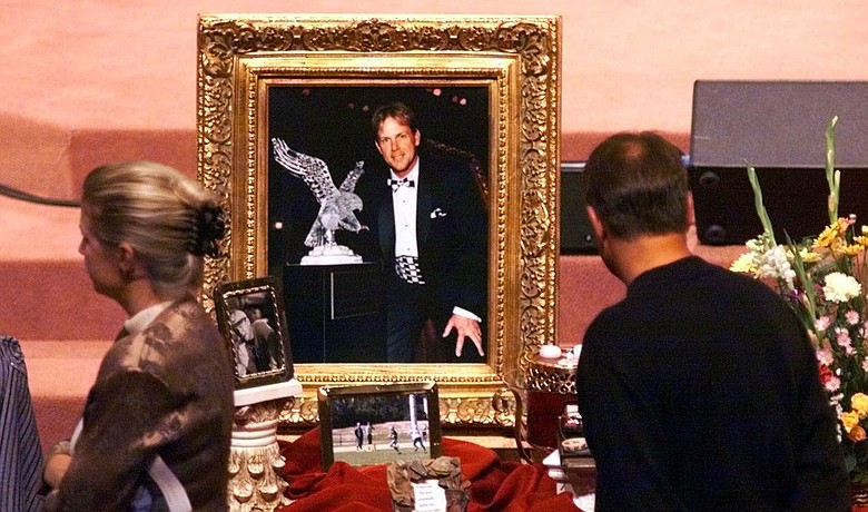 Mourners view photos and memoribilia of Payne Stewart during a memorial service Oct. 29, 1999 at the First Baptist Church in Orlando, Fla.