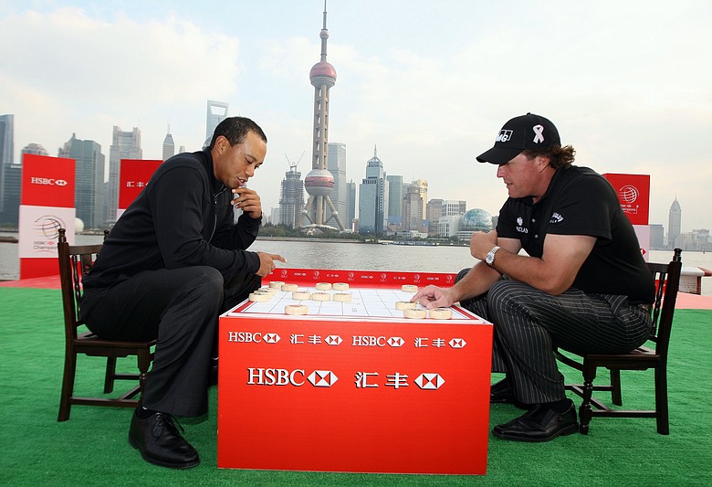 Tiger Woods and Phil Mickelson during a game of Chinese chess during the the Official 2009 WGC-HSBC Photocall at the Shanghai Port International Cruise Terminal on November 3, 2009.