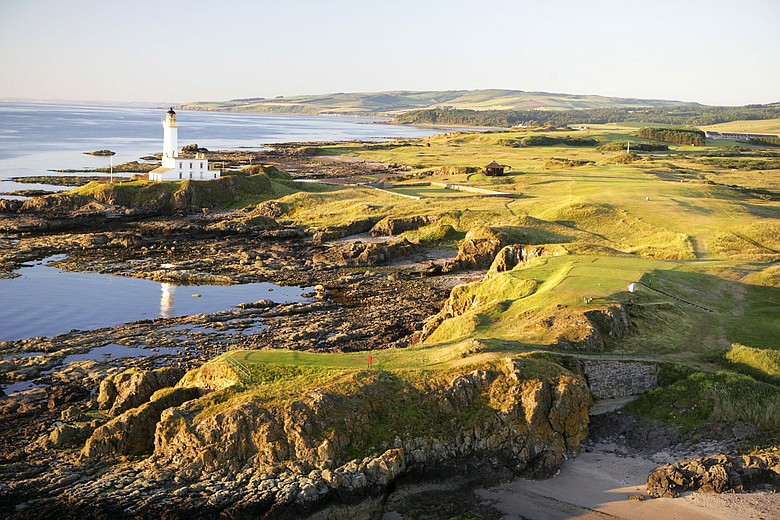An aerial view of the par-4 9th hole that runs past the lighthouse on the Ailsa Course at The Westin Turnberry Resort.