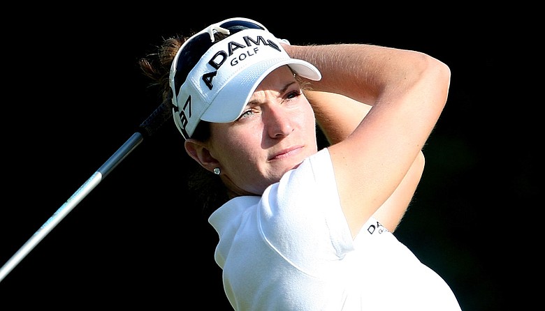 Brittany Lang tees off on the ninth hole during the Mizuno Classic.