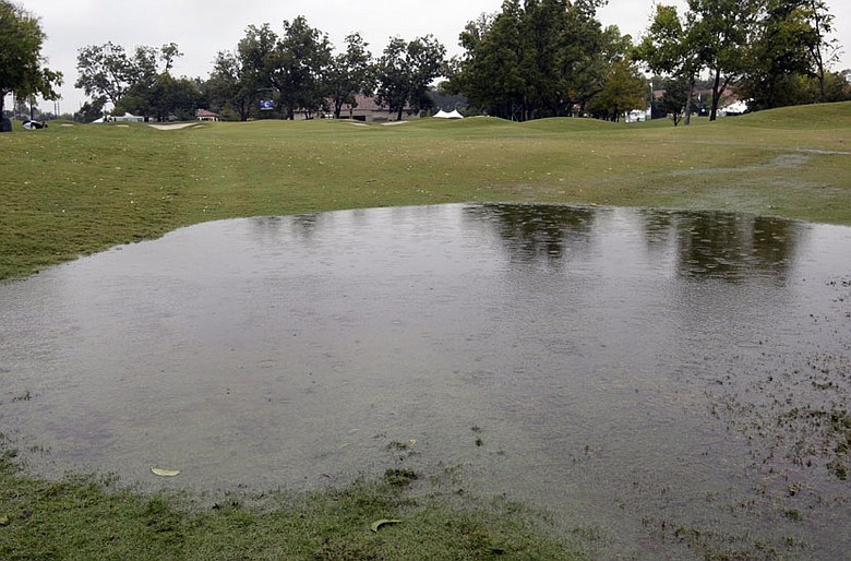 Rain gathers on the ninth fairway Saturday at the Houstonian G&CC in Richmond, Texas.