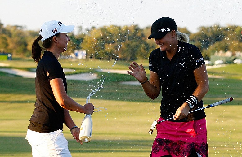 Anna Nordqvist (right) celebrates with fellow Swede Louise Stahle after her two-stroke victory at the LPGA Tour Championship.