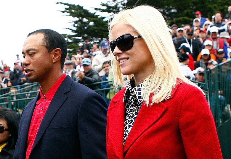 Tiger Woods walks with his wife, Elin, during the closing ceremonies of the Presidents Cup in October.