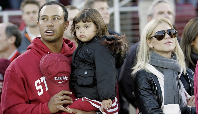 Tiger Woods with his daughter Sam and wife Elin.