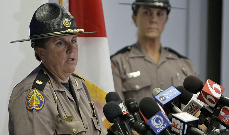Maj. Cindy Williams (left) with the Florida Highway Patrol during a Dec. 1 news conference concerning Tiger Woods' accident. Sgt. Kim Montes looks on.
