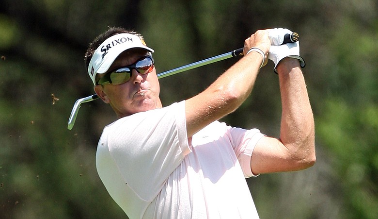 Robert Allenby plays his second shot at the 6th hole during the final round of the Nedbank Golf Challenge.
