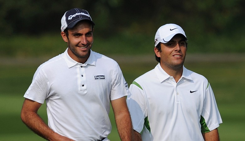 Edoardo, left, and Francesco Molinari walk at the ninth during the Omega Mission Hills World Cup.