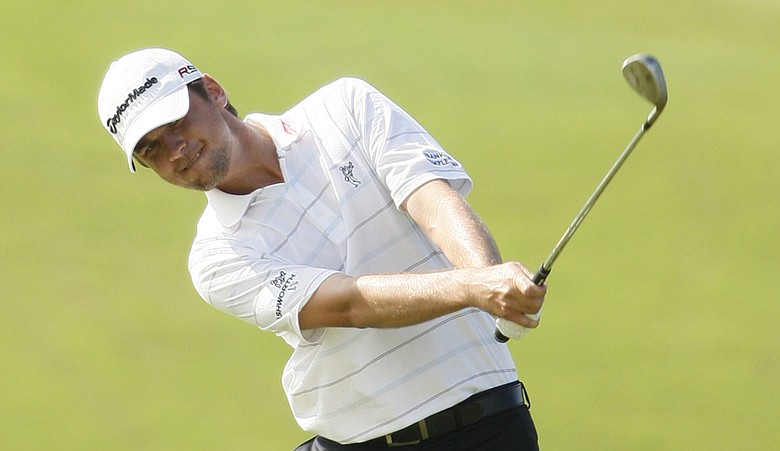 Sean O'Hair chips to the ninth green during the second round of the SBS Championship.