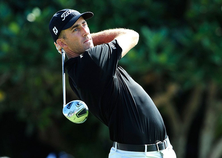 Geoff Ogilvy wins the first PGA Tour event in 2010 wearing Travis Mathew apparel.