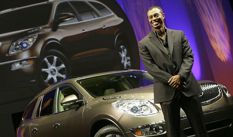 Tiger Woods introduces the 2008 Buick Enclave at the 2006 Los Angeles Auto Show.