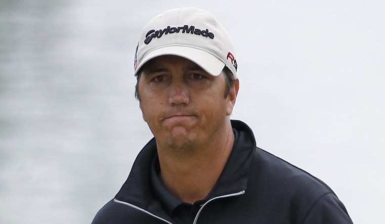 Shane Bertsch watches his chip for eagle just miss on the eighth hole at PGA West's Jack Nicklaus Private Course during the first round of the Bob Hope Classic.