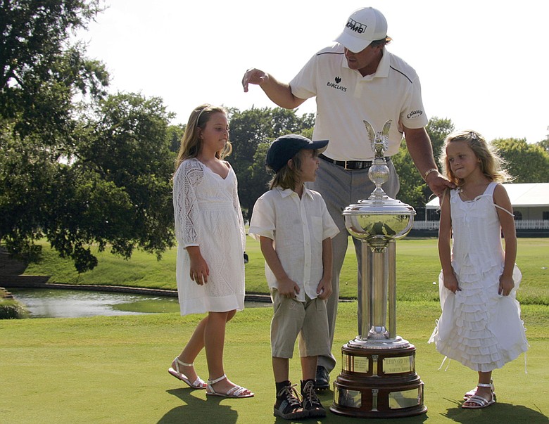 Phil Mickelson with his children, Amanda, left, 8 Evan, center, 5 and Sophia , 6, after he won the 2008 Colonial.
