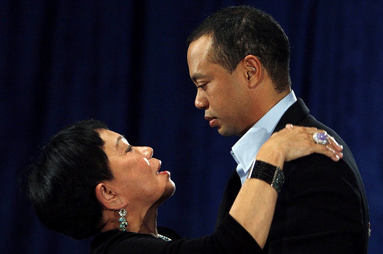 Tiger Woods hugs his mother, Kultida, after making his statement.
