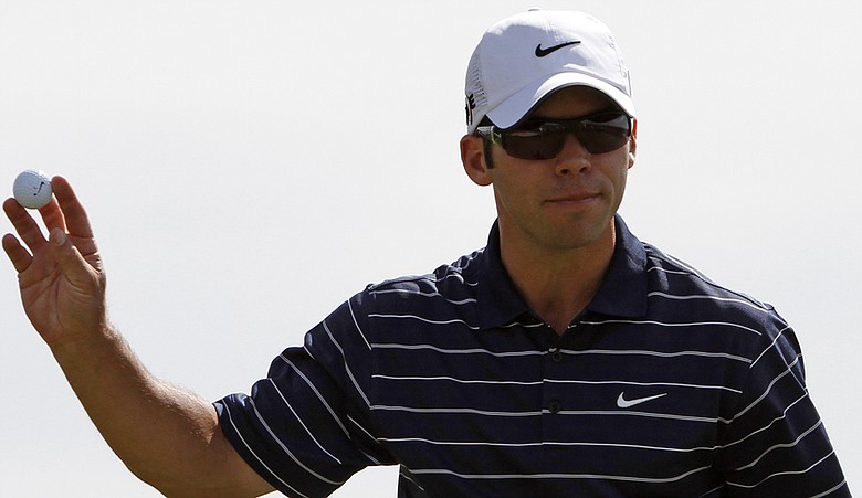 Paul Casey waves to the gallery after defeating Brian Gay, 5 and 4, during the third round of the Match Play Championship.