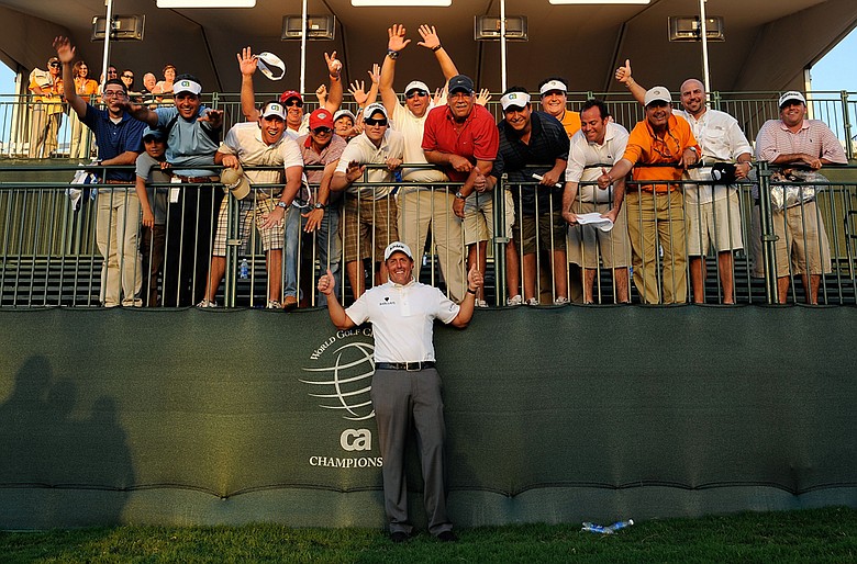 Phil Mickelson celebrates with a group of fans after winning the 2009 WGC-CA Championship.