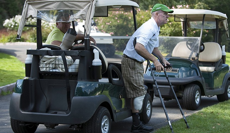 Ken Green prepares to walk from a golf cart at a charity golf tournament on Sept. 28, 2009, at the Ridgewood Country Club in Danbury, Conn.