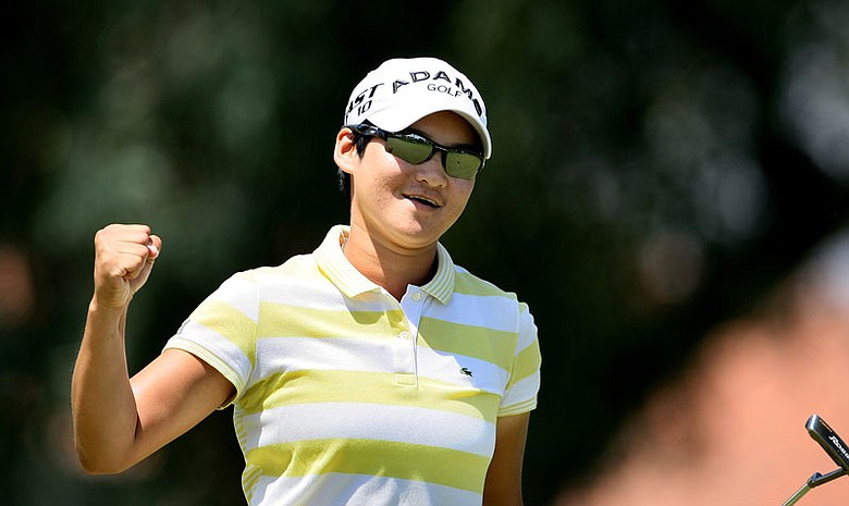 Yani Tseng pumps her fist after dropping a birdie putt at No. 8 during the final round of the Kraft Nabisco Championship.