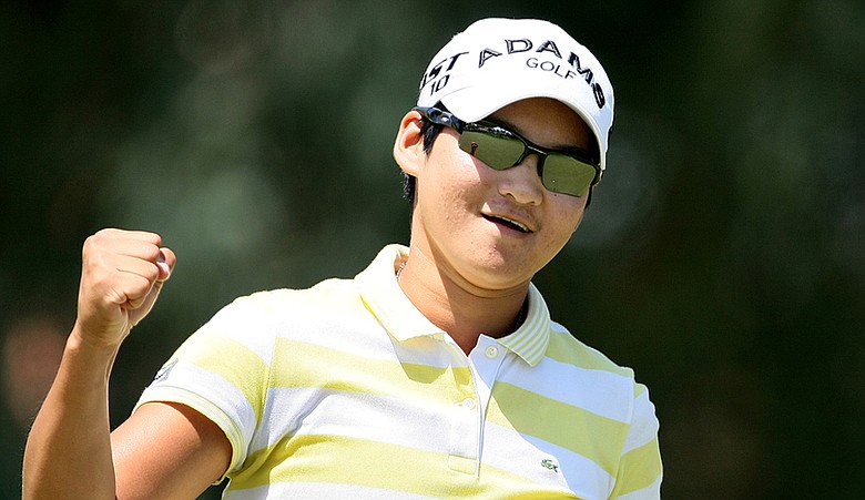 Yani Tseng pumps a fist at No. 8 during the final round of the Kraft Nabisco Championship.