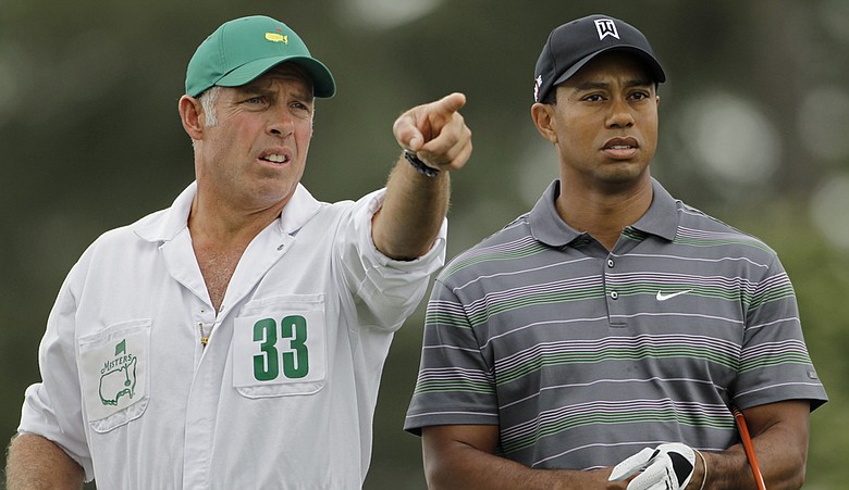 Tiger Woods and caddie Steve Williams on No. 1 Thursday at Augusta National.