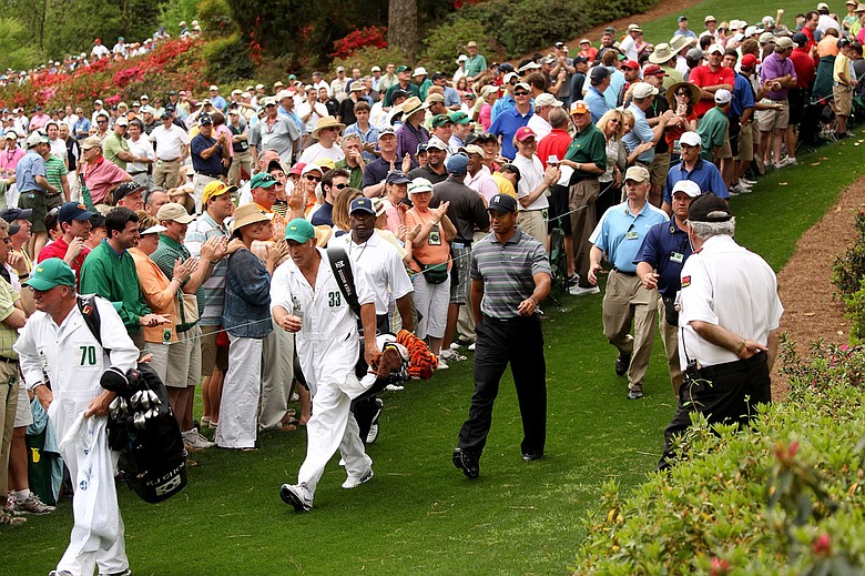 Tiger Woods and his caddie Steve Williams walk to the seventh tee Thursday.