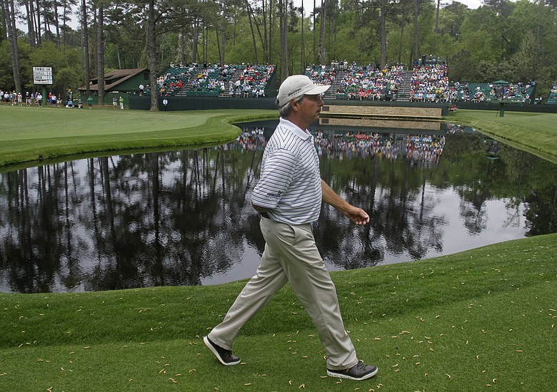 Fred Couples walks to the 15th green during the first round of the Masters.