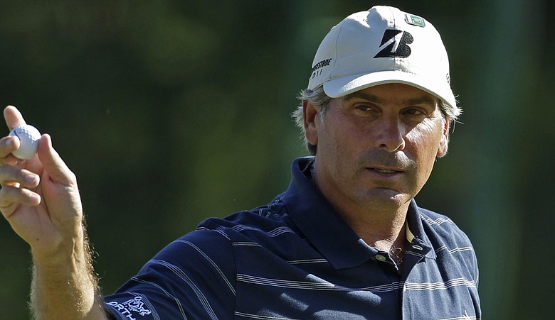 Fred Couples acknowledges patrons after a birdie at the 14th.