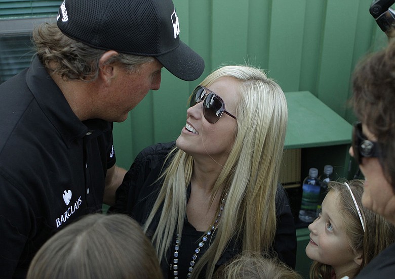 Phil Mickelson is met by his wife, Amy, and family after winning the Masters.