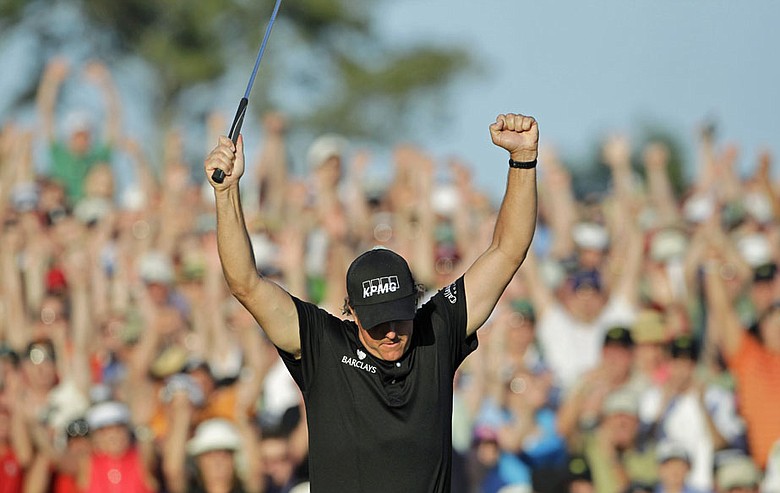 Phil Mickelson reacts after winning the 2010 Masters.